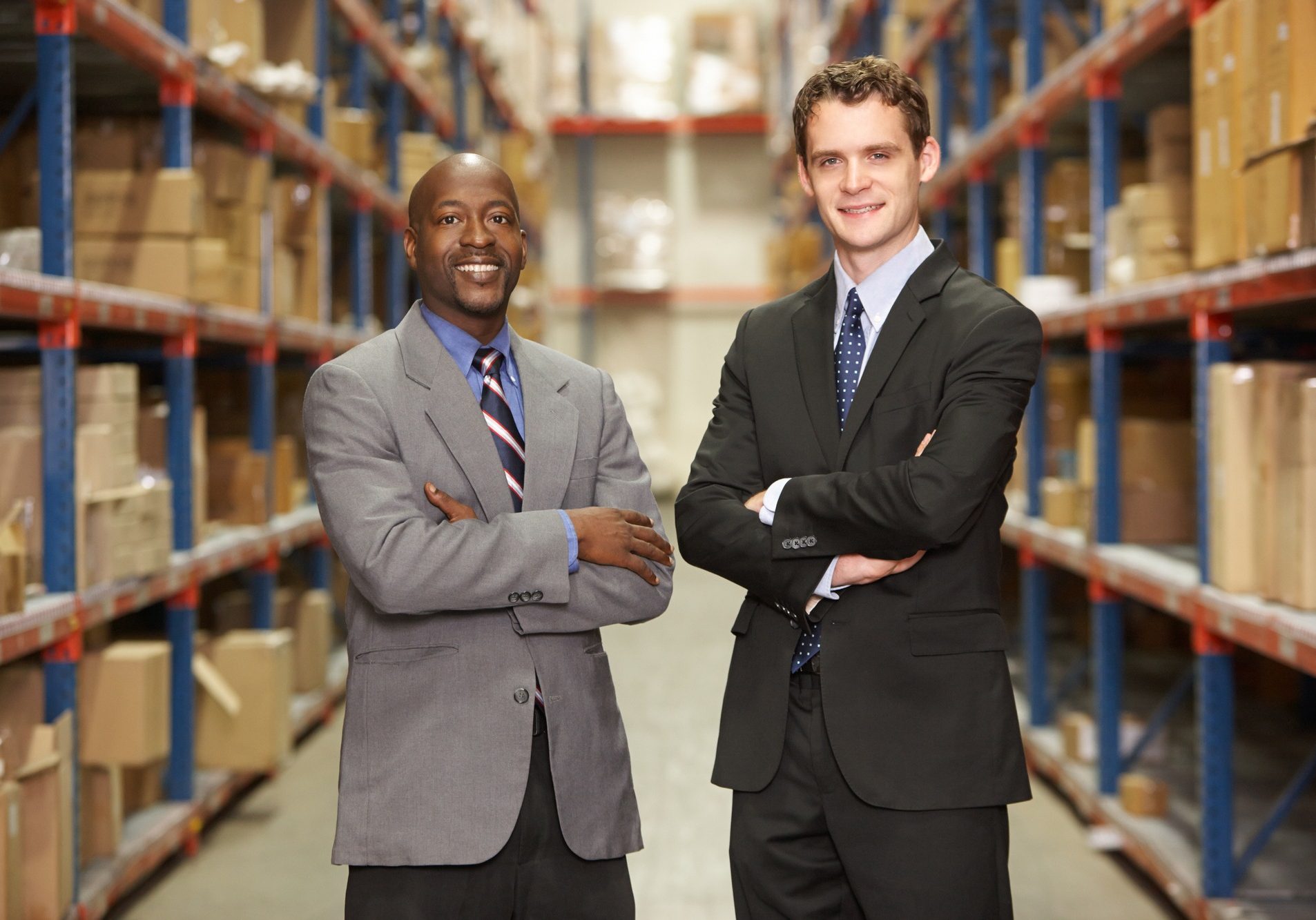 Portrait Of Two Businessmen In Warehouse
